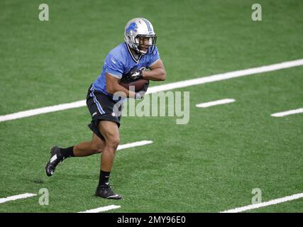 Detroit Lions running back George Winn (38) is upended by Cleveland Browns  defensive back Aaron Berry (38) in the first half of a preseason NFL  football game at Ford Field in Detroit