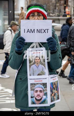 London, UK – Feb 4, 2023: A protester carrying pictures of people who have been executed in the Islamic Republic of Iran during recent crackdowns against protesters, saying: I AM NEXT (victim). About two hundred British-Iranians from different political backgrounds marched from Cavendish Square to Trafalgar Square, asking the UK government to put the Islamic Revolutionary Guard Corps of Iran on its terrorist list.  Credit: Sinai Noor/Alamy Live News Stock Photo