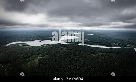 Moody sky before a storm over land of lakes Stock Photo