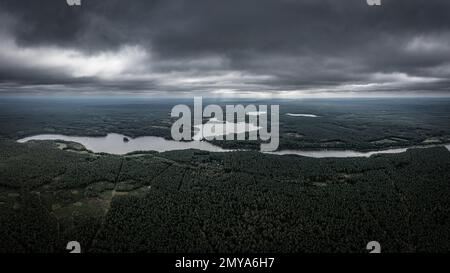 Moody sky before a storm over land of lakes Stock Photo