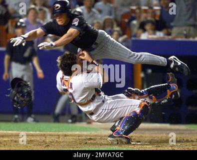 FILE - In this Aug. 26, 2000, file photo, Arizona Diamondbacks' Jay Bell is  tagged out at home plate by New York Mets catcher Mike Piazza in the fourth  inning of a