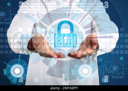 Cyber attack protection. Woman demonstrating scheme with lock illustration, closeup Stock Photo