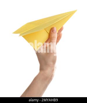 Woman holding yellow paper plane on white background, closeup Stock Photo