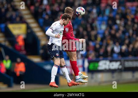 Gethin Jones #2 of Bolton Wanderers in aerial challenge with the opponent during the Sky Bet League 1 match between Bolton Wanderers and Cheltenham Town at the University of Bolton Stadium, Bolton on Saturday 4th February 2023. (Credit: Mike Morese | MI News) Credit: MI News & Sport /Alamy Live News Stock Photo