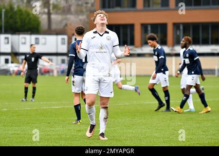 Swansea, Wales. 4 February 2023. Iwan Morgan of Swansea City high fives  Aimar Govea of Swansea City during the Professional Development League game  between Swansea City Under 18 and Millwall Under 18