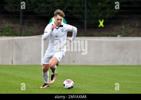 Swansea, Wales. 4 February 2023. Iwan Morgan of Swansea City high fives  Aimar Govea of Swansea City during the Professional Development League game  between Swansea City Under 18 and Millwall Under 18