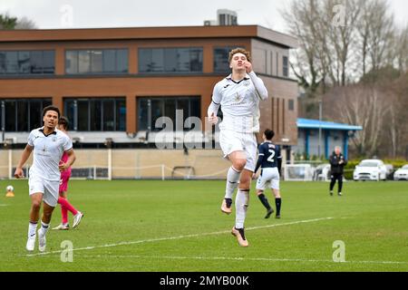 Swansea, Wales. 4 February 2023. Iwan Morgan of Swansea City high fives  Aimar Govea of Swansea City during the Professional Development League game  between Swansea City Under 18 and Millwall Under 18