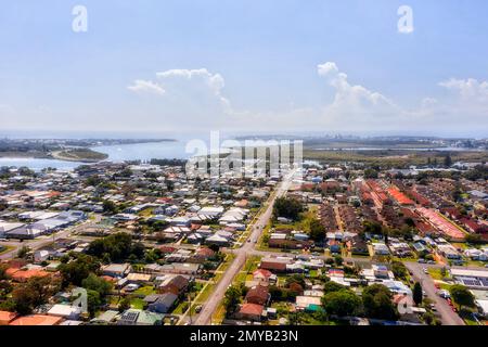 Swansea coastal town in City of Lake Macquarie on Pacific ocean shore of Australia - aerial view over lake mouth lagoon. Stock Photo