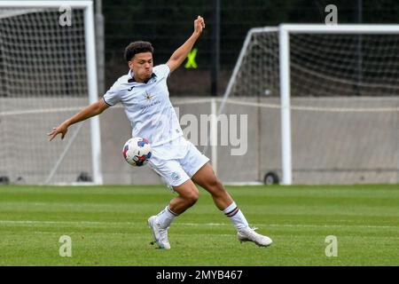 Swansea, Wales. 4 February 2023. Zane Myers of Swansea City under pressure  from Oliver Evans of Millwall during the Professional Development League  game between Swansea City Under 18 and Millwall Under 18