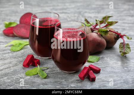 Freshly made beet juice on grey table Stock Photo