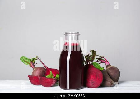 Freshly made beet juice on grey table Stock Photo