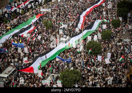 Shiite rebels, known as Houthis, hold a poster of their leader Abdul ...