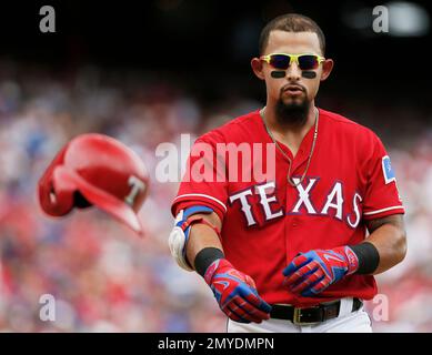 Texas Rangers' Rougned Odor tosses his bat after hitting a single against  the Baltimore Orioles during the first inning of a baseball game Friday,  Aug. 3, 2018, in Arlington, Texas. (AP Photo/Richard