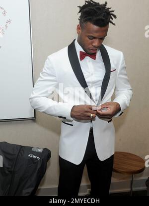 IMAGE DISTRIBUTED FOR JCPENNEY - First round draft pick Deshaun Watson,  drafted by the Houston Texans, shows of his style as he wears a  custom-lined COLLECTION by Michael Strahan suit jacket available