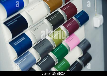 11.24.2022 Warsaw, Poland. Car wrapping film color picker. Samples of varnish colors at mechanic's or car detailing studio. . High quality photo Stock Photo