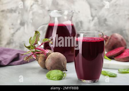 Freshly made beet juice on grey table Stock Photo