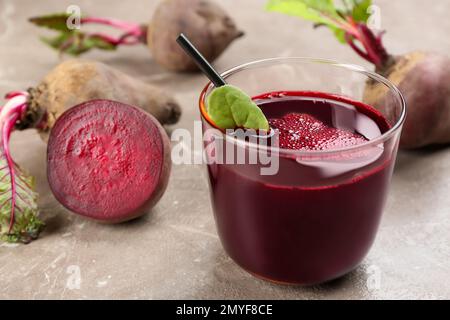 Freshly made beet juice on grey table Stock Photo