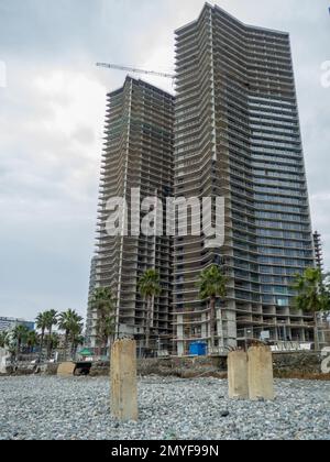 Reinforced concrete pile sticking out of the ground. Construction on the beach. Abandoned. Armature at sea. Destroyed building. building Stock Photo