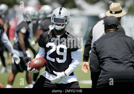 Oakland Raiders cornerback David Amerson (29) defends a pass intended for  San Diego Chargers wide receiver Dontrelle Inman (15) during the second  half of an NFL football game in Oakland, Calif., Thursday