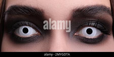 Mysterious witch with spooky eyes, closeup. Halloween party Stock Photo