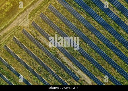 Solar panels installed outdoors, aerial top view. Alternative energy source Stock Photo