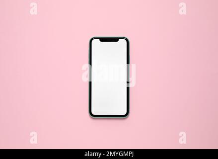 MYKOLAIV, UKRAINE - JULY 07, 2020: iPhone 11 on pink background, top view. Mockup for design Stock Photo