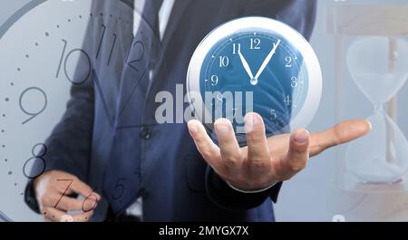 Time management concept. Multiple exposure with man and clocks, closeup Stock Photo