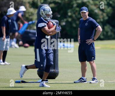 Dallas Cowboys passing game coordinator and linebackers coach, Matt  Eberflus, throws a pass as he runs players through drills during an NFL  football training camp, Wednesday, June 8, 2016, in Irving, Texas. (