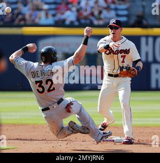 Georgia shortstop Gordon Beckham (6) throws out Atlanta Braves