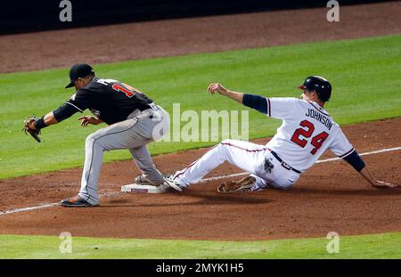 Atlanta Braves' Gordon Beckham throws out a St. Louis Cardinals