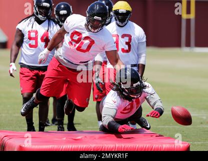 Atlanta Falcons' Deion Jones, left, works against Torrey Green during a  drill at a football practice Monday, May 23, 2016, in Flowery Branch, Ga.  (AP Photo/David Goldman Stock Photo - Alamy