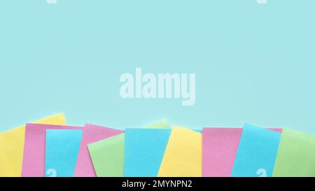 Copy space background with a multi color empty sticky paper note. Stock Photo
