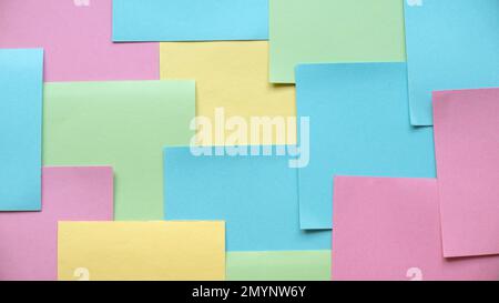 Background of a stack multicolor empty sticky paper note. Stock Photo