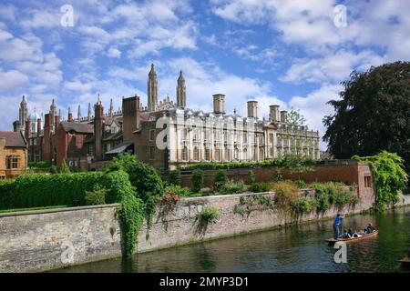 Cambridge, England -  View of Cambridge University from across the River Cam, with boaters in a punt. Stock Photo
