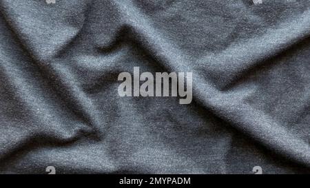 Grey fabric cloth with folds background and texture. Stock Photo