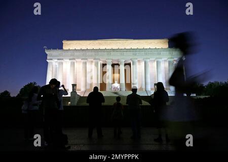 https://l450v.alamy.com/450v/2mypppk/file-in-this-oct-1-2013-file-photo-people-stand-and-jog-in-front-of-the-steps-of-the-lincoln-memorial-in-washington-a-record-number-of-us-tourists-visited-washington-last-year-the-citys-tourism-bureau-destination-dc-announced-tuesday-may-3-2016-that-the-nations-capital-welcomed-193-million-domestic-visitors-in-2015-thats-up-one-million-from-the-2014-total-and-it-shows-the-continuing-strength-of-washingtons-tourism-industry-after-the-great-recession-ap-photoalex-brandon-file-2mypppk.jpg