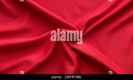 Red fabric cloth with folds background and texture. Stock Photo