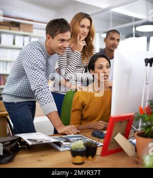 Creating perfection as a team. A young team of design professionals having a meeting. Stock Photo