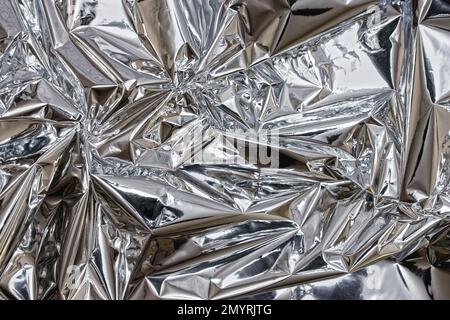 Shiny silver foil close-up. Abstract background, glossy surface Stock Photo