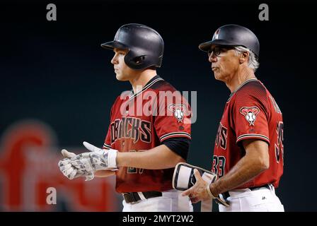 Arizona Diamondbacks' Brandon Drury, left, drips with Gatorade as he  celebrates his game-winning sacrifice fly against the Atlanta Braves with a  bat boy, right, and Jean Segura (2) in the 11th inning