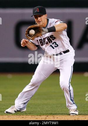 Arizona Diamondbacks' Nick Ahmed fields the ball against the St. Louis  Cardinals during the first inning of a baseball game, Tuesday, July 25,  2023, in Phoenix. (AP Photo/Matt York Stock Photo - Alamy