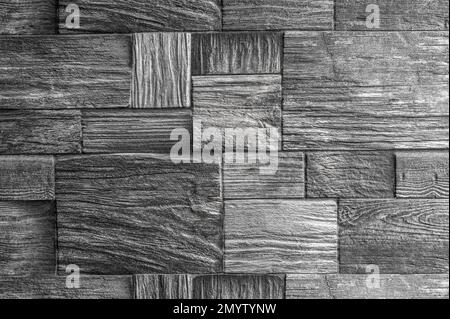 stone block wall texture. Stone Wall, Grey Bricks Background. Faded dark black rock stone wall texture background. Modern stone wall decoration Stock Photo