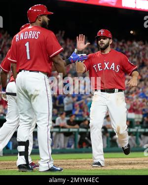 The Texas Rangers' Elvis Andrus shows off his beard to teammates durin a  workout for Game 6 of the American League Championship Series against the  Detroit Tigers at Rangers Ballpark in Arlington