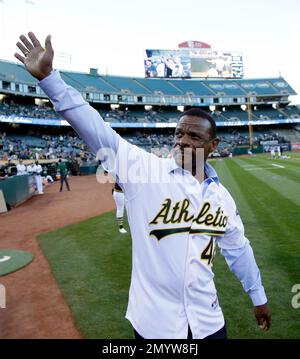 Former Oakland Athletics player Dave Stewart throws out the ceremonial  first pitch before a baseball game between the Athletics and the San  Francisco Giants in Oakland, Calif., Sunday, Aug. 25, 2019. (AP