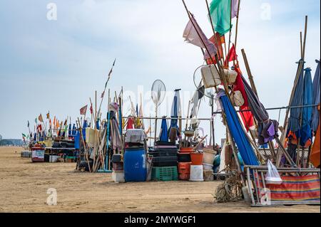 fishing accessories, tools and nets. Fishing nets collected on sand beach. Fishing nets. fishing nets dry on shore Stock Photo