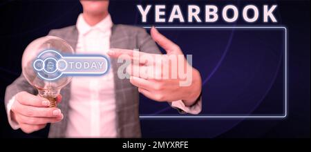 Sign displaying Yearbook. Concept meaning publication compiled by graduating class as a record of the years activities Stock Photo