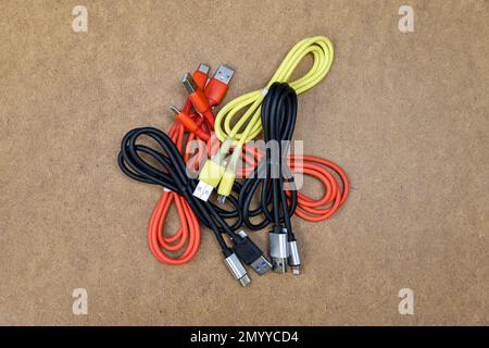 Lots of type-c and lightning connector charging cords Stock Photo