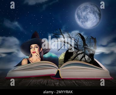 Fantasy world. Open book of fairytales with witch and black crow on pages Stock Photo