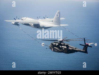 In this March 2016 photo released by the U.S. Navy, An MH-53E Sea Dragon helicopter from the Blackhawk of Helicopter Mine Countermeasures Squadron HM 15 conducts an aerial refueling exercise with a KC-130 tanker off the coast of Norfolk Va. (U.S. Navy/Petty Officer 3rd Class Taylor N. Stinson via AP)