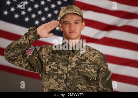 Confident military soldier saluting against close up of the us flag ...